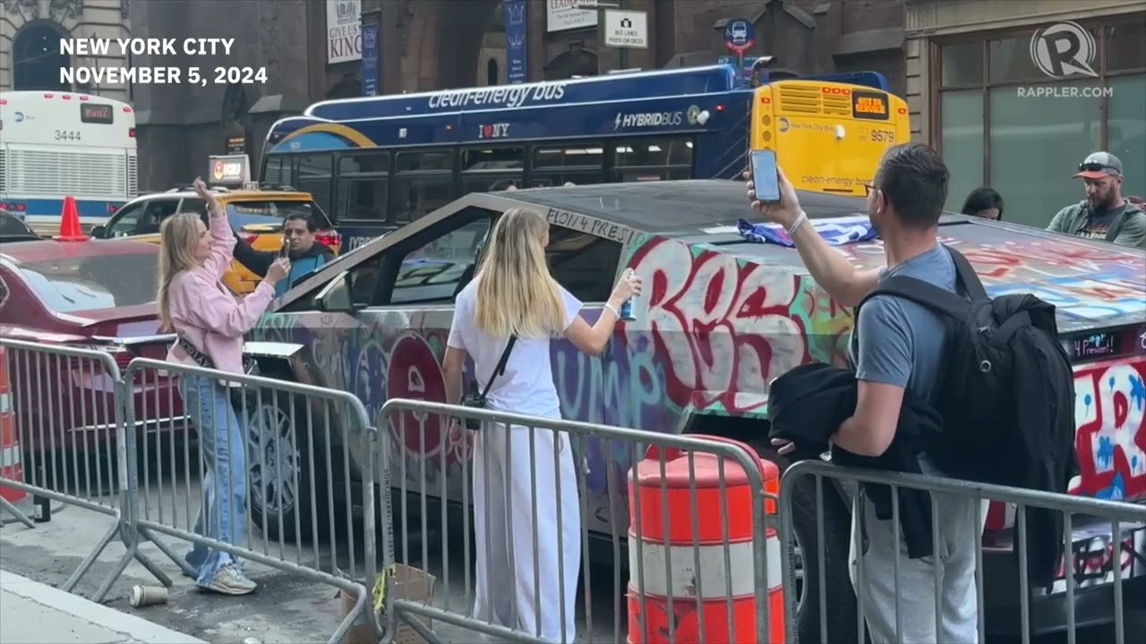 Trump supporters spray graffiti on a Tesla Cybertruck near Trump Tower #USvote
