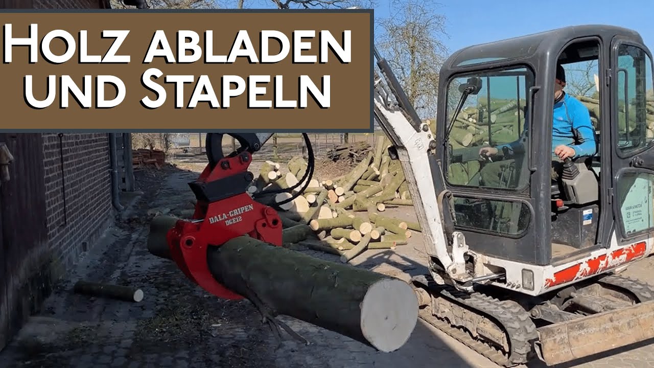 Brennholz mit Humbaur Anhänger abkippen, stapeln mit Bagger Bobcat 319 / Holzgreifer Dala Gripen DGE