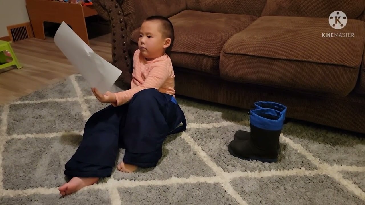 Tilee trying on his snow pants