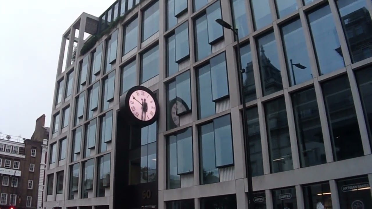 Man in the Clock near Paddington Station, London