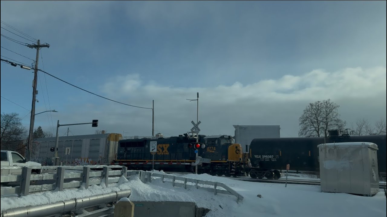 CSX manifest train with dpu in the snow  