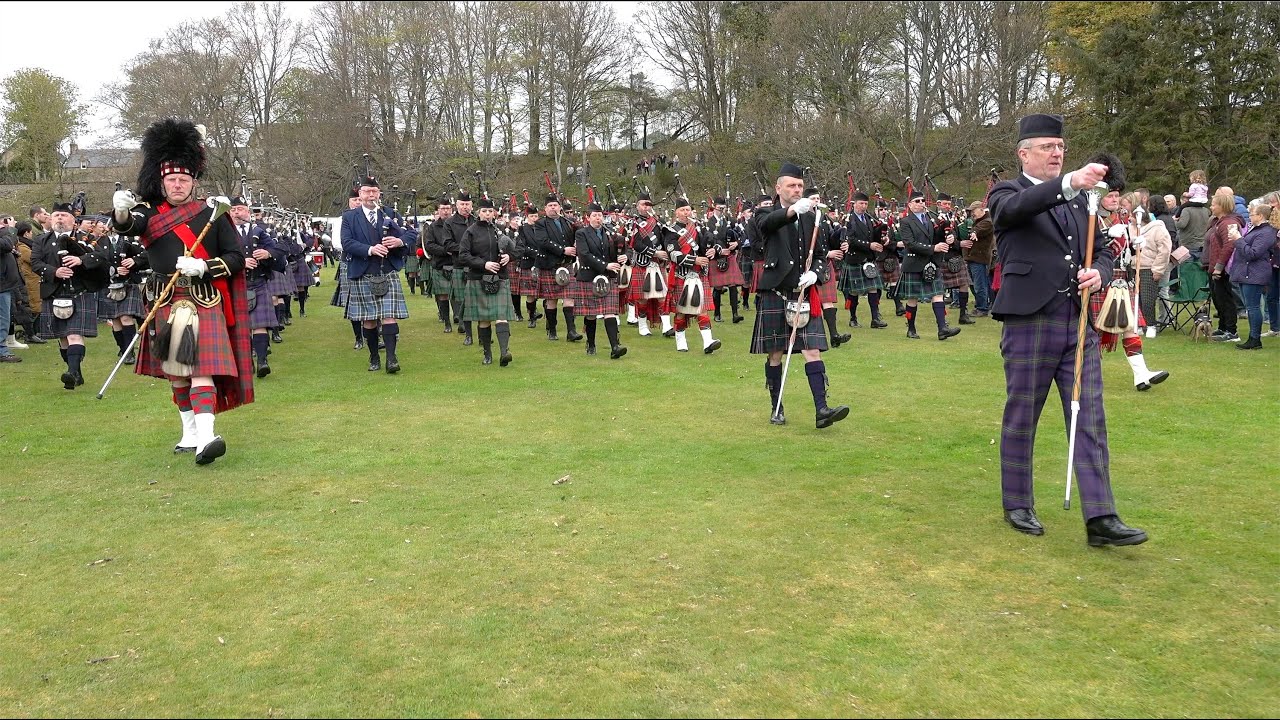 Massed pipe bands of Scottish Highlands playing I See Mull on the march in Crawl Park Alness 2023