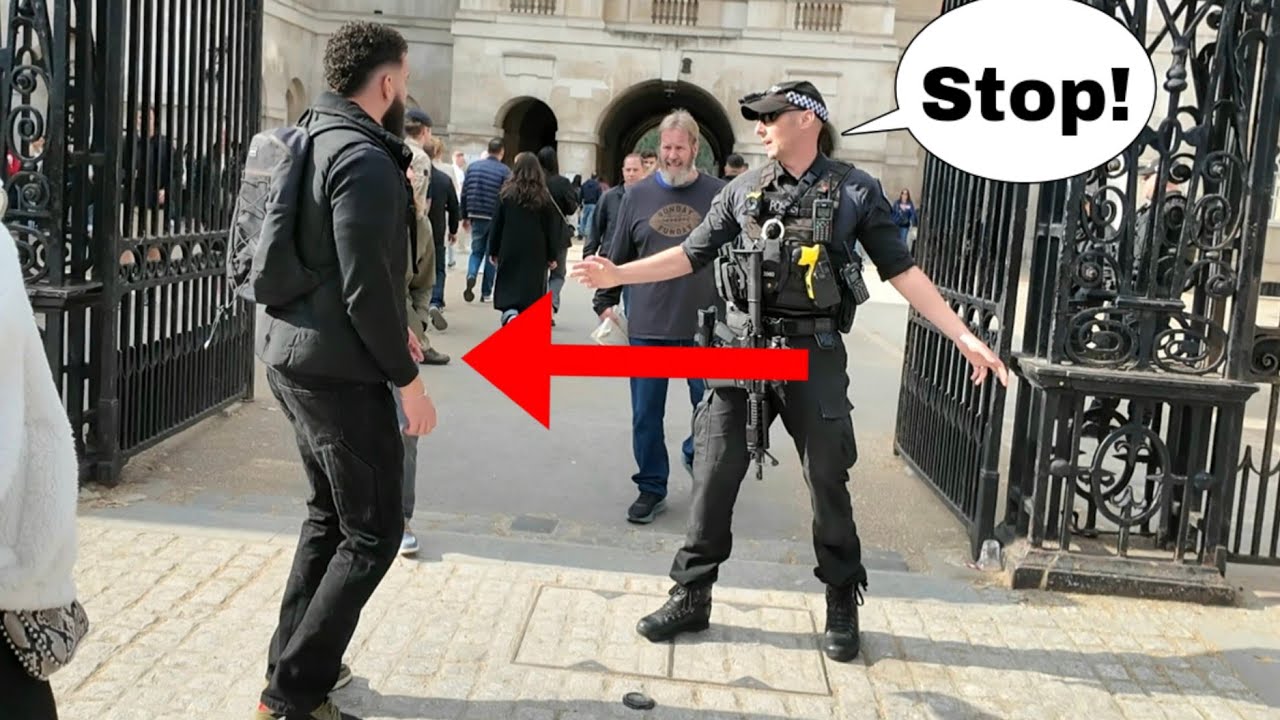 The officer blocked the tourist and did not let him inside!
