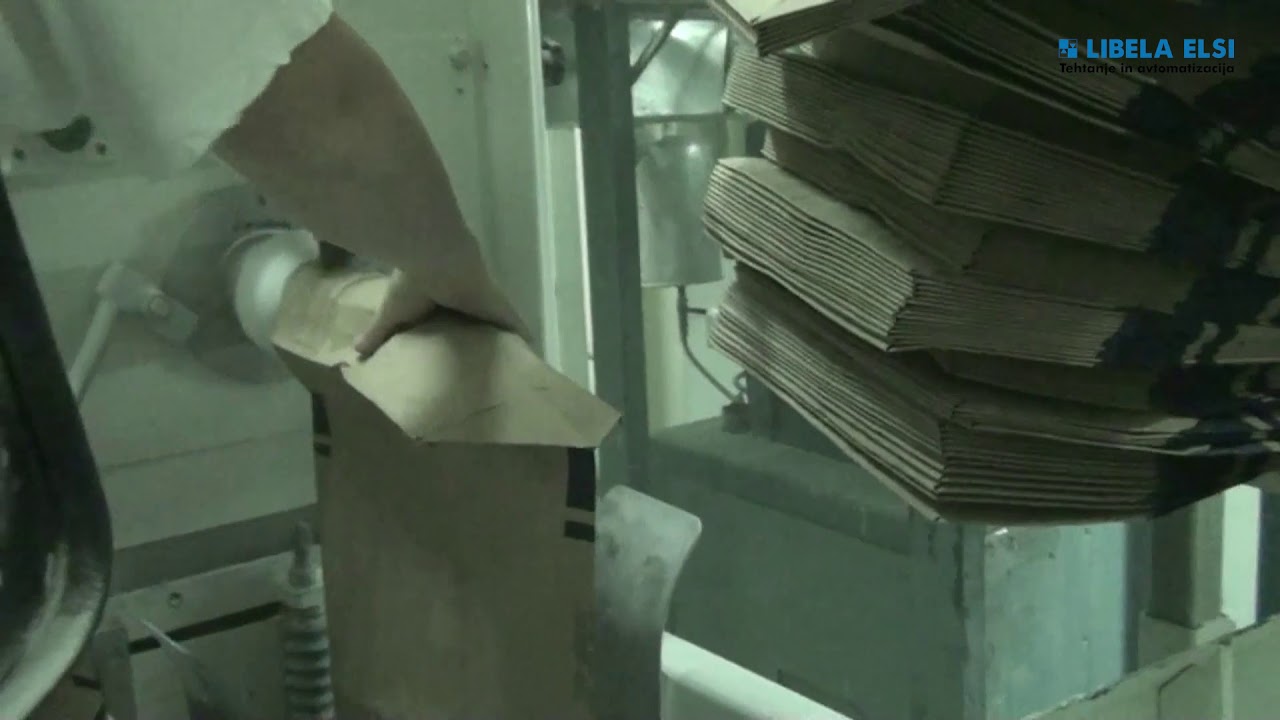 Polavtomatski sistem za polnjenje v ventil vreče