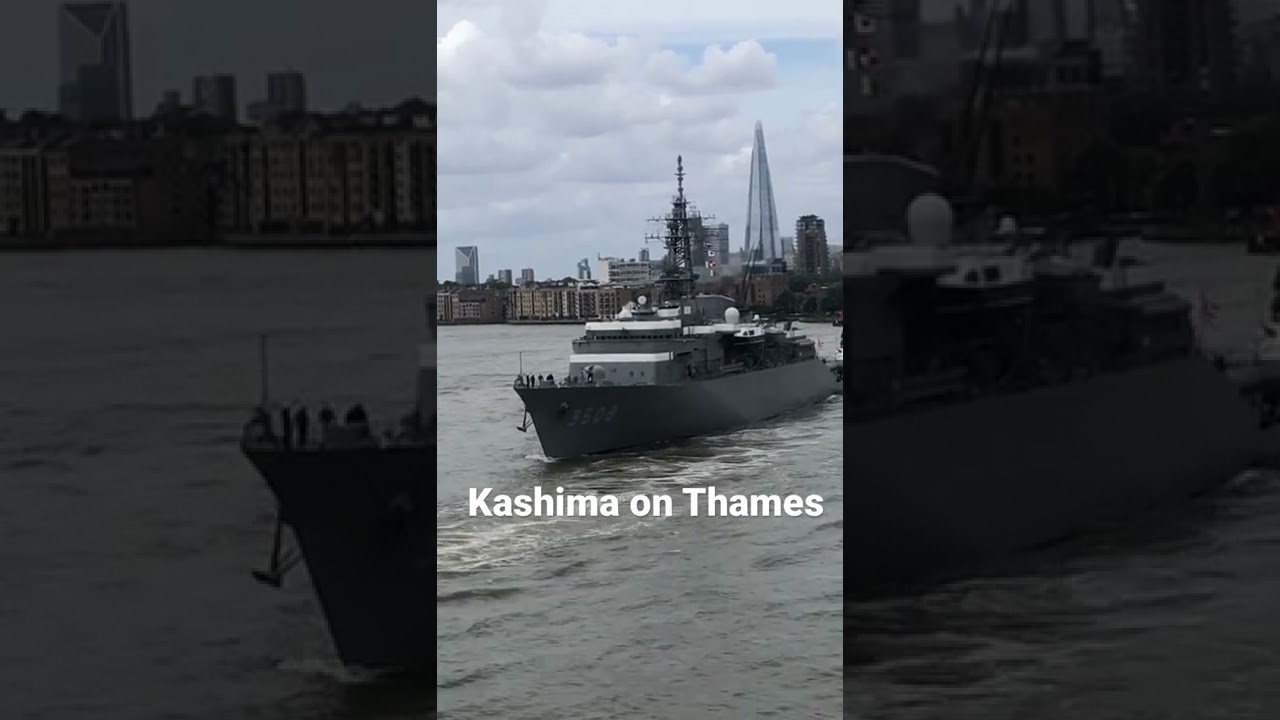 Japanese ‘Kashima’ military ship sailing down stream on River Thames, London.