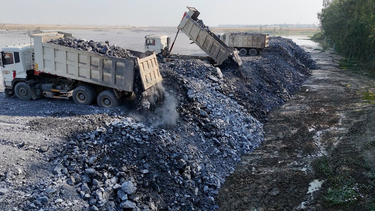 Fantastic Driver Use Bulldozer Push Stone and Dump Truck Unloading Stone Filling Huge Lake