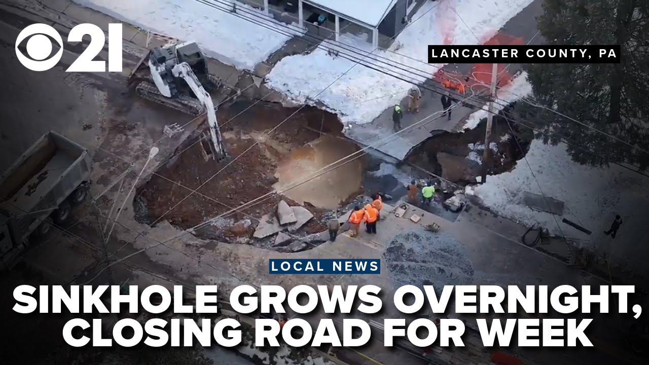 Flying over huge sinkhole that grew overnight, closing roads for a week