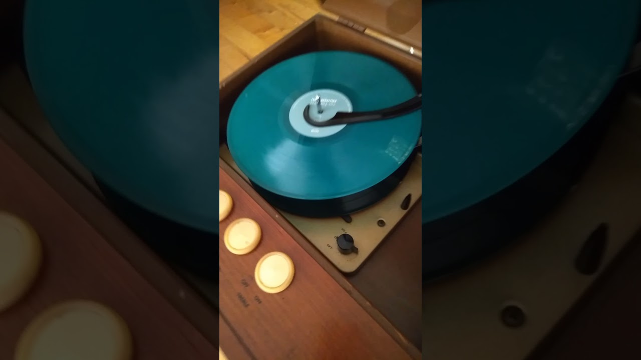 Magnavox Consolette Tube record player playing a couple LP records