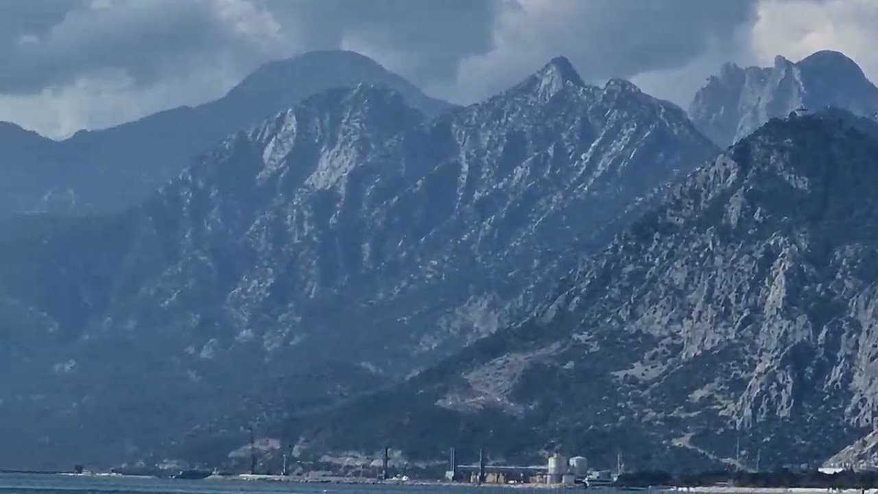 Crystal clear water with a mountain backdrop #turkey #tourism #travel #sea #beach 