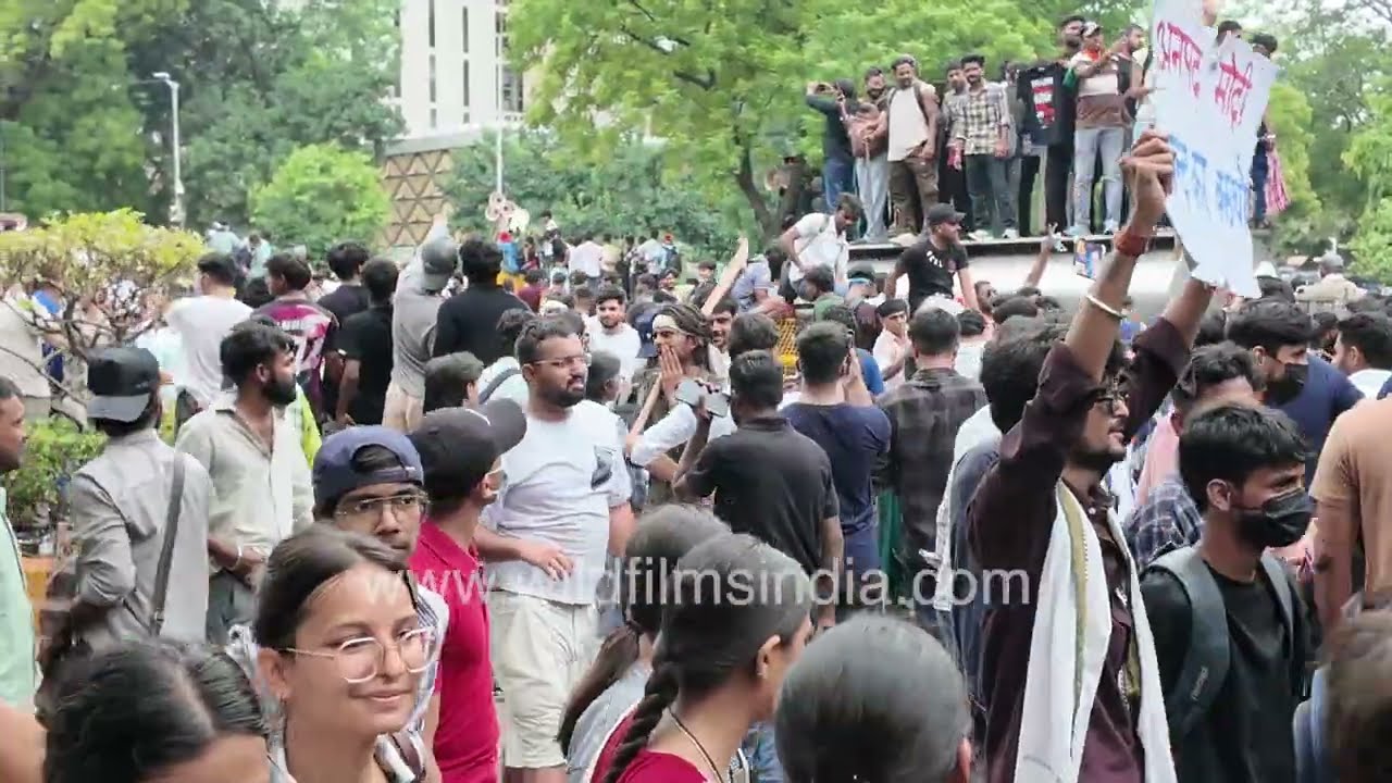 Cockroach Janta Party supporters celebrate after Education Minister's resignation at Jantar Mantar
