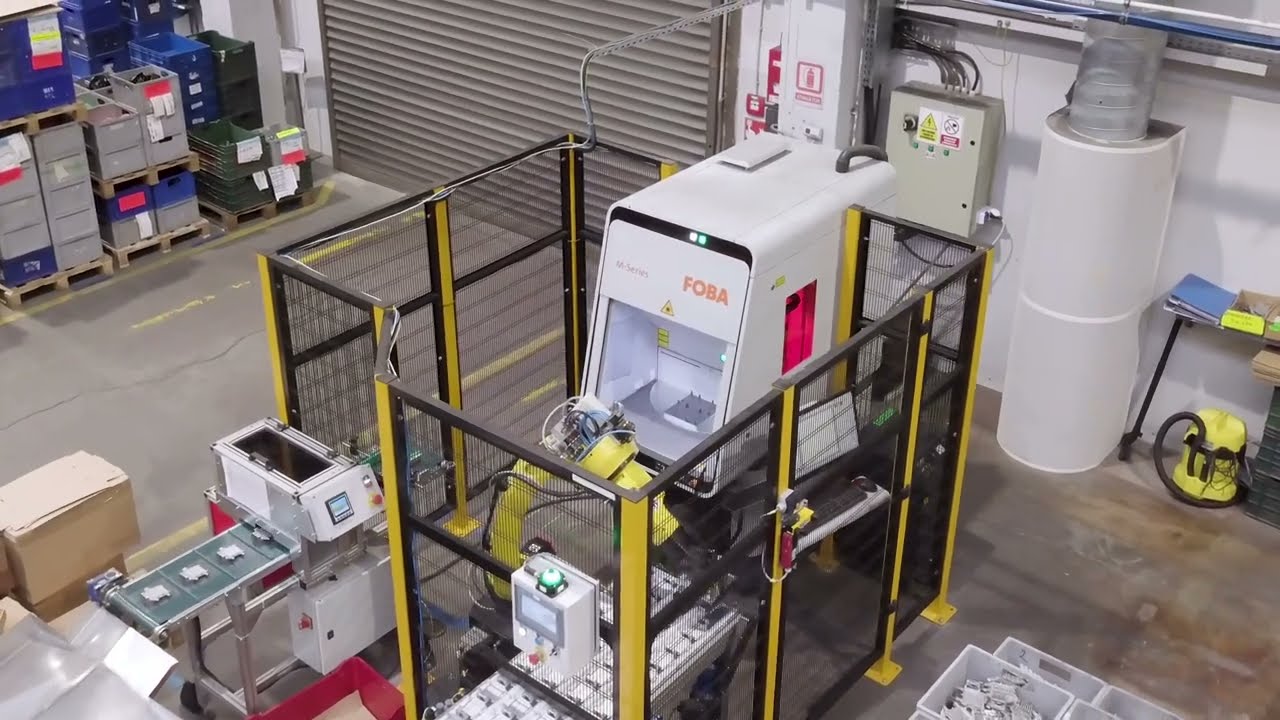 FANUC Robot M-10iD/12 assisting laser machine | Somipress Case Study