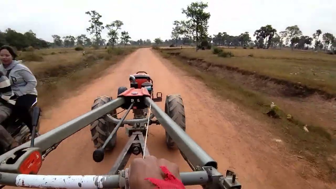M325, Kubota ZT140 Tractor Driving Home on Dirt Road