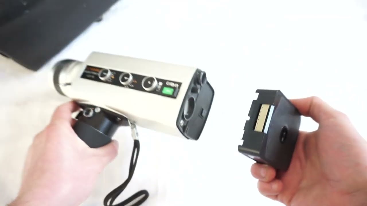 Yashica LD 8 loading Super 8 film and batteries on Super 8 camera Yashica Electro 8 LD-8 Super 8