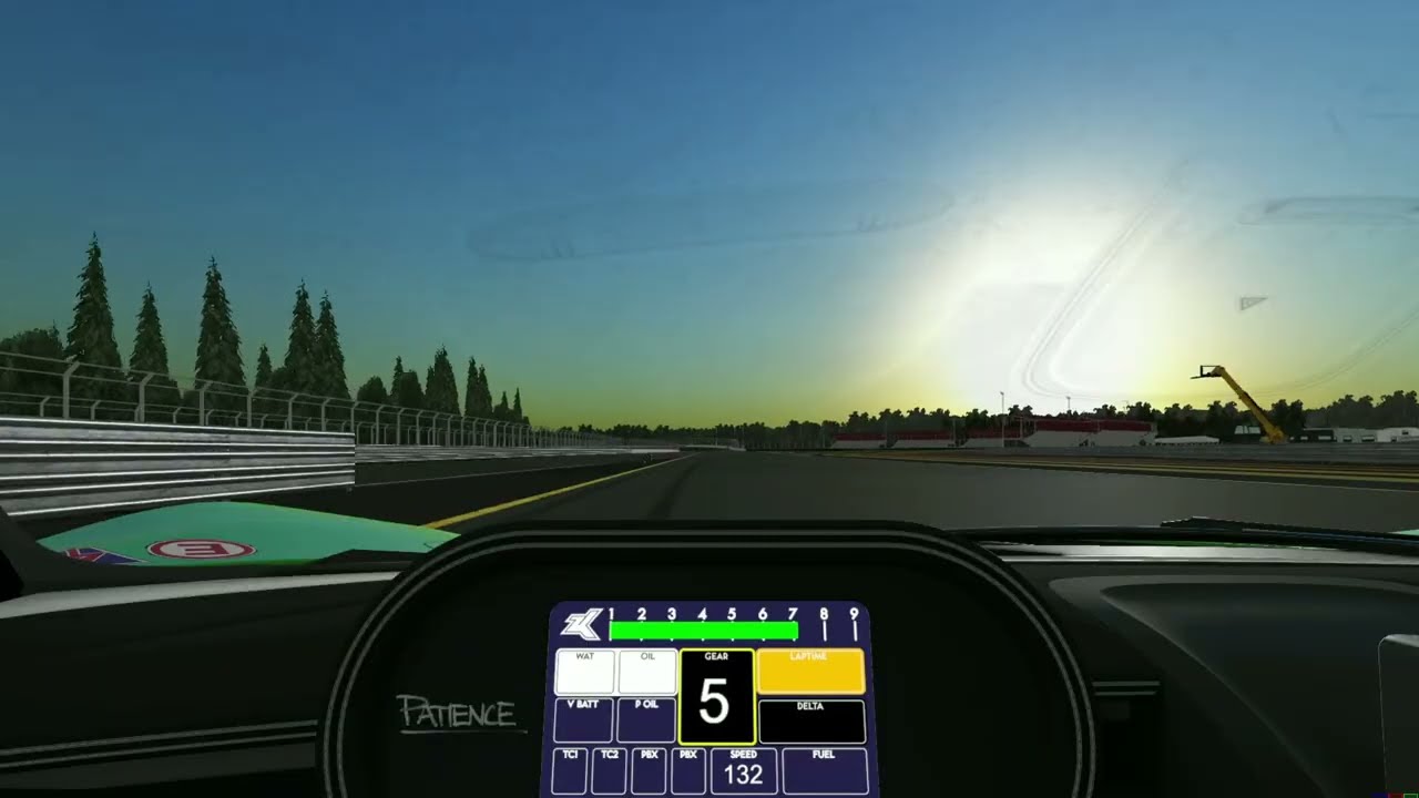 Racing sim at dusk with electronic dashboard