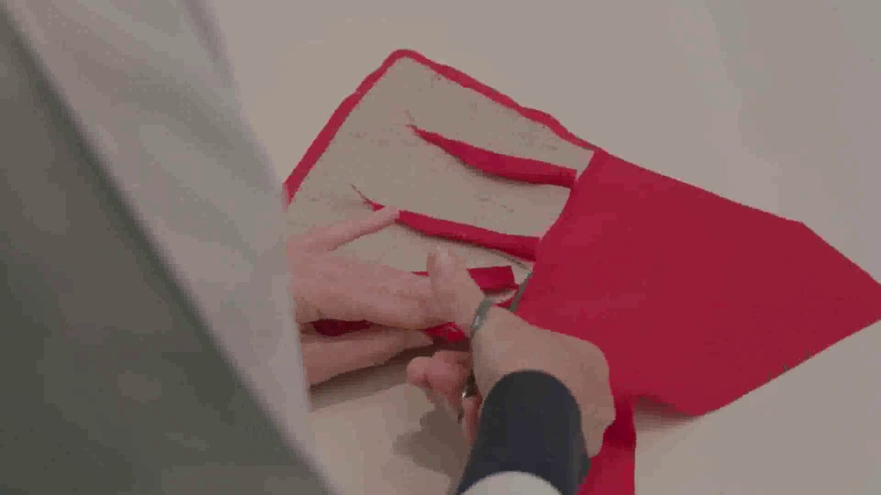 THE HOUSE OF DIOR AT NGV making Red Bar Coat in Dior Atelier