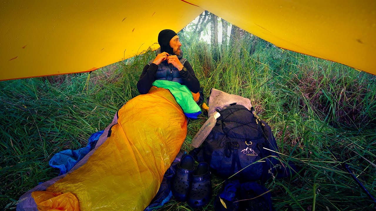 New Zealand South Island Traverse: Tarp camping in the rain along the river