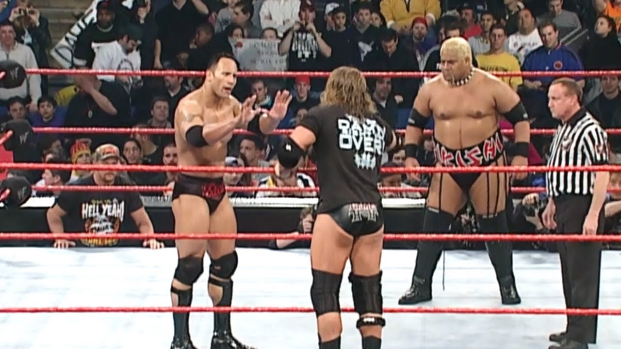 The Rock w/ Triple H & Stephanie McMahon Vs Rikishi w/ 