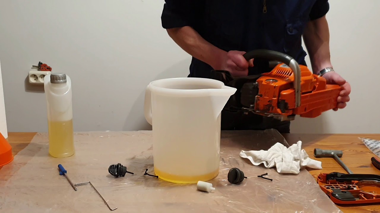 Flushing The Fuel And Oil Tank Of A Husqvarna Chainsaw.