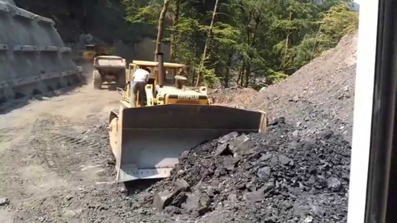 Cat D9 & Komatsu PC360 loading Volvo A25D