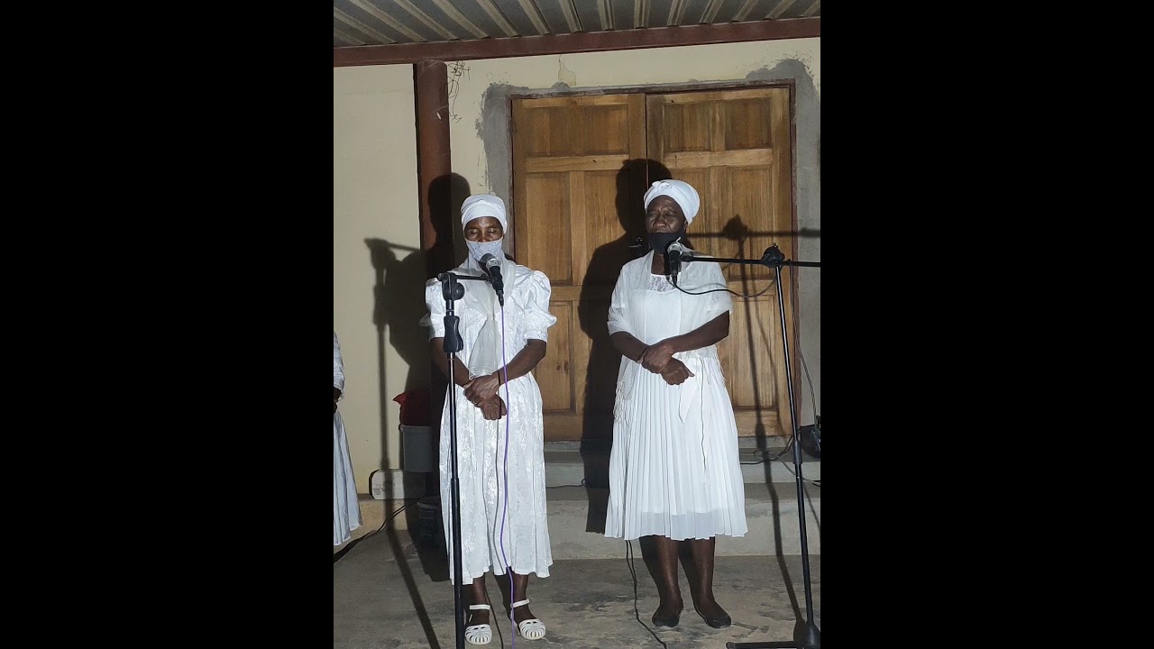 Uitani parishioners praying during partnership Sunday