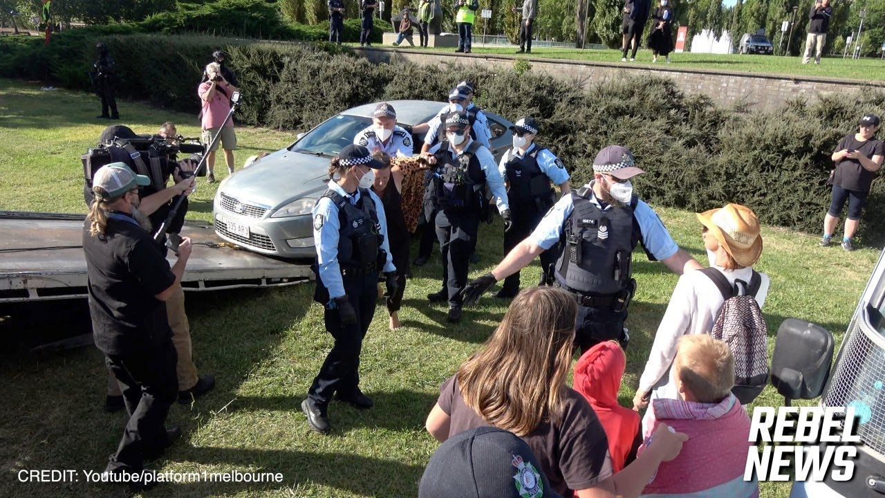 Mother is pushed to the ground by a senior cop in front of crying children