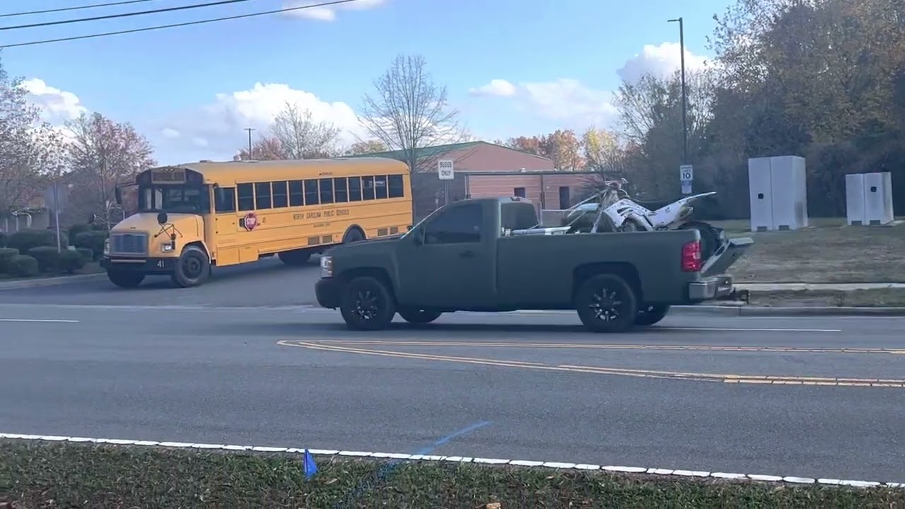 School Busses leaving bus lot