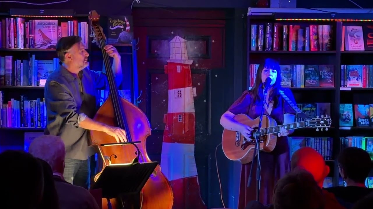 Lucy Kitchen is a British folk singer-songwriter plays at Medina Bookshop. Cowes. Isle of Wight.