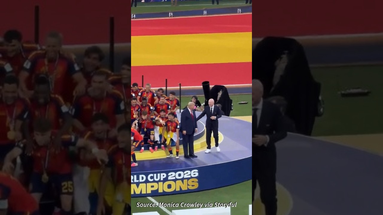 Donald Trump lingers on stage after World Cup trophy presentation