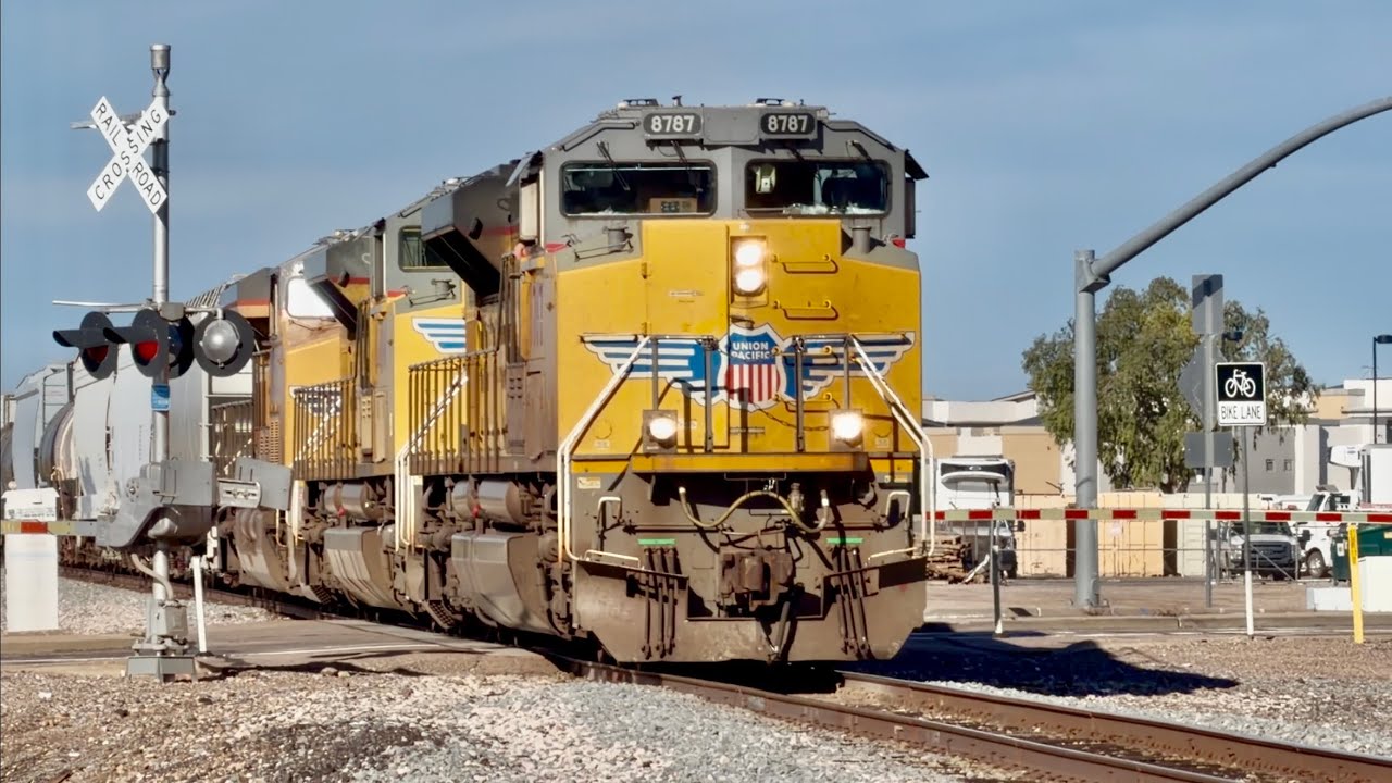 UP 8787 and 8484 lead a eastbound manifest train through Queen Creek AZ