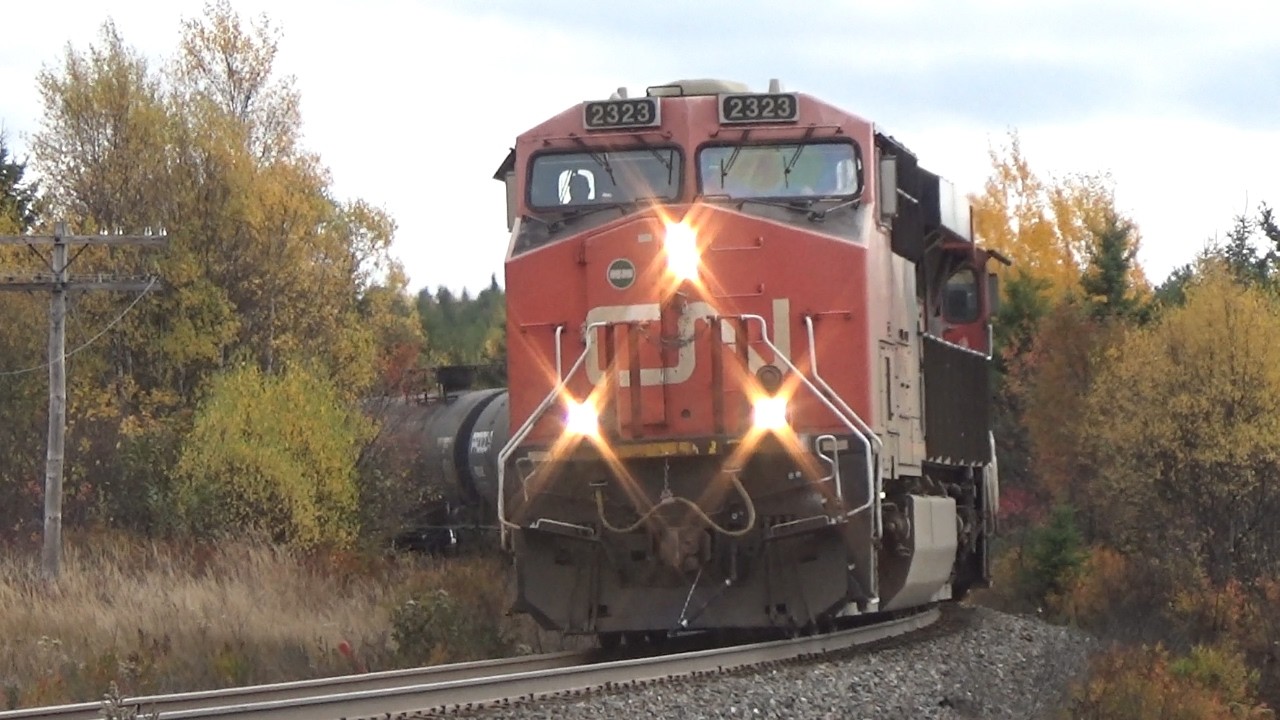 Long Manifest Train CN 507 Rolling Down the Hill at Dorchester, NB at Track Speed
