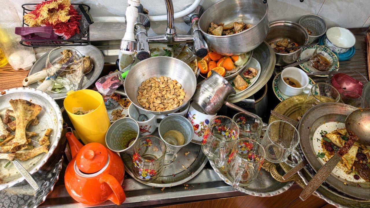 Dish Washing in a Messy Sink Turning Calm