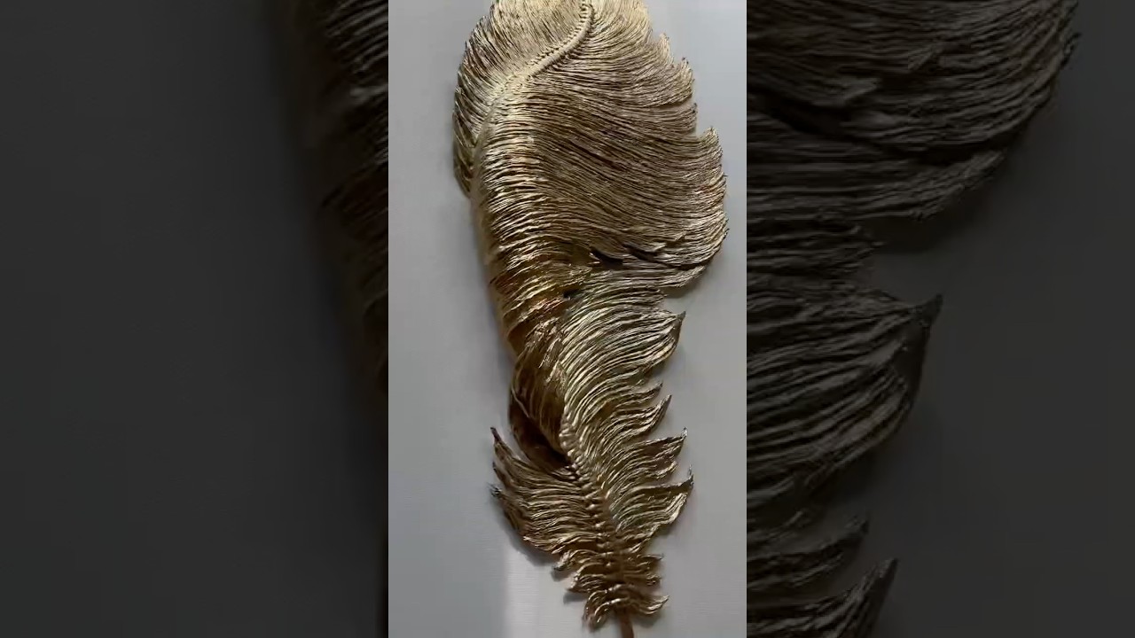 A gorgeous macramé rope feather made entirely by hand.