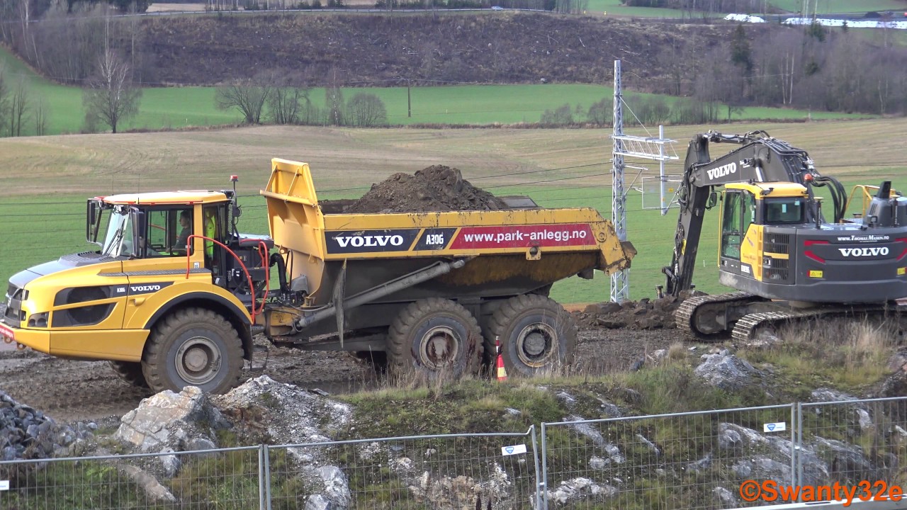 4K| Volvo ECR235E Excavator Loading Volvo A30G