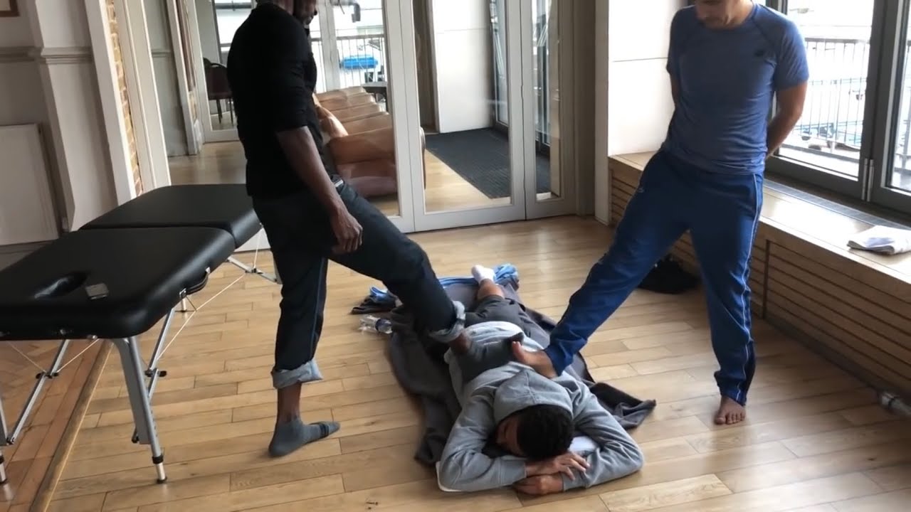 Ashiatsu (massaging with feet). Some of our Advanced students practicing Raynor foot massage