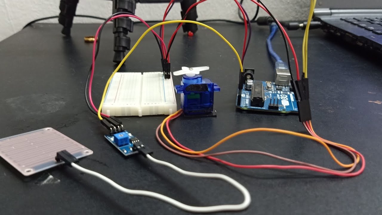 Rain drop sensor with servo motor