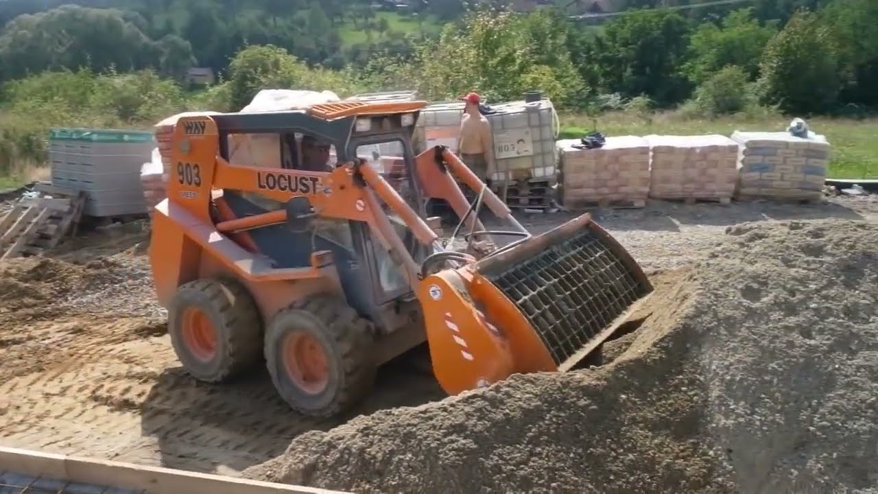 Concrete mixer Kovaco ML 300 on a Locust L 903 skid steer loader