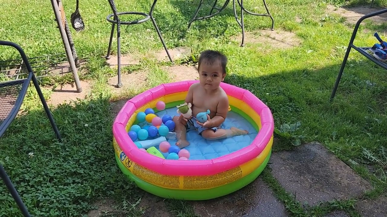 It's Hot So Baby Playing In The Pool!