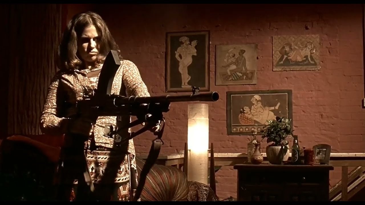 Girl with machine gun. Scene from Lock, Stock and Two Smoking Barrels