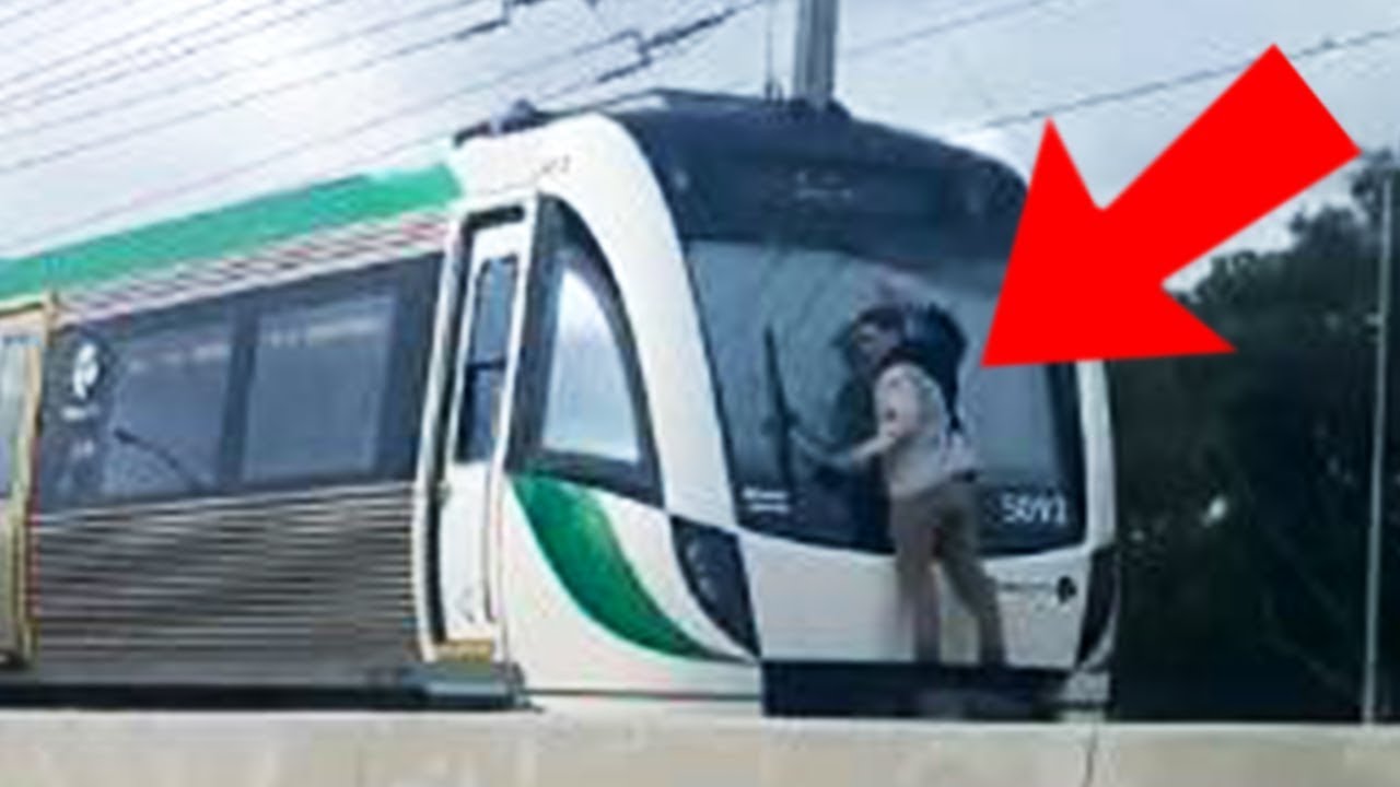 Man Clings For His Life On High Speed Train &ndash; CAUGHT ON CAMERA
