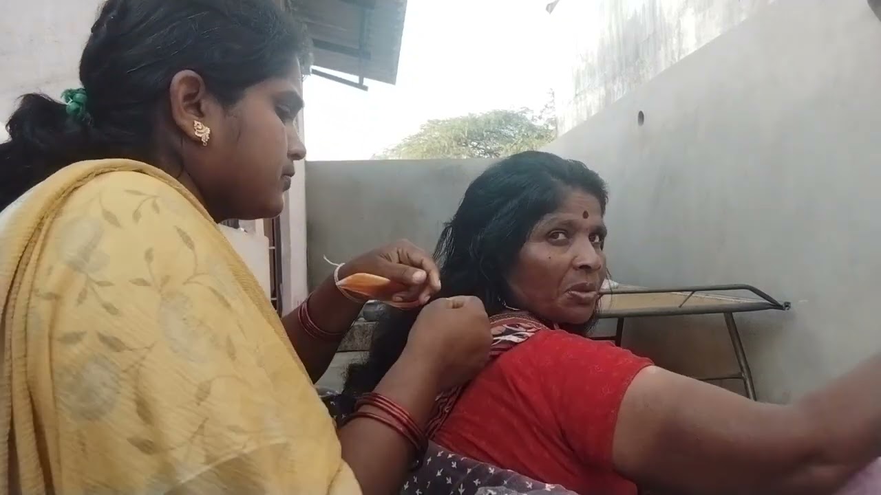 nitpicking by village woman