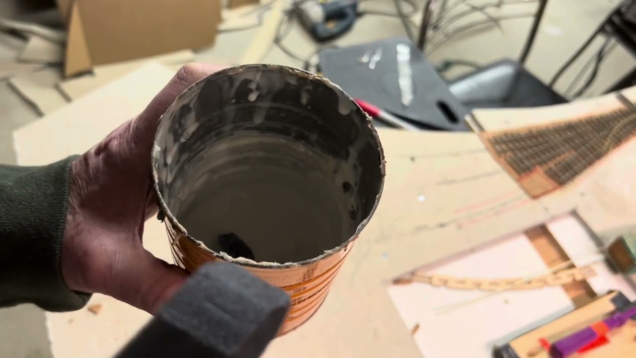 Making and applying cork roadbed for a model railroad.
