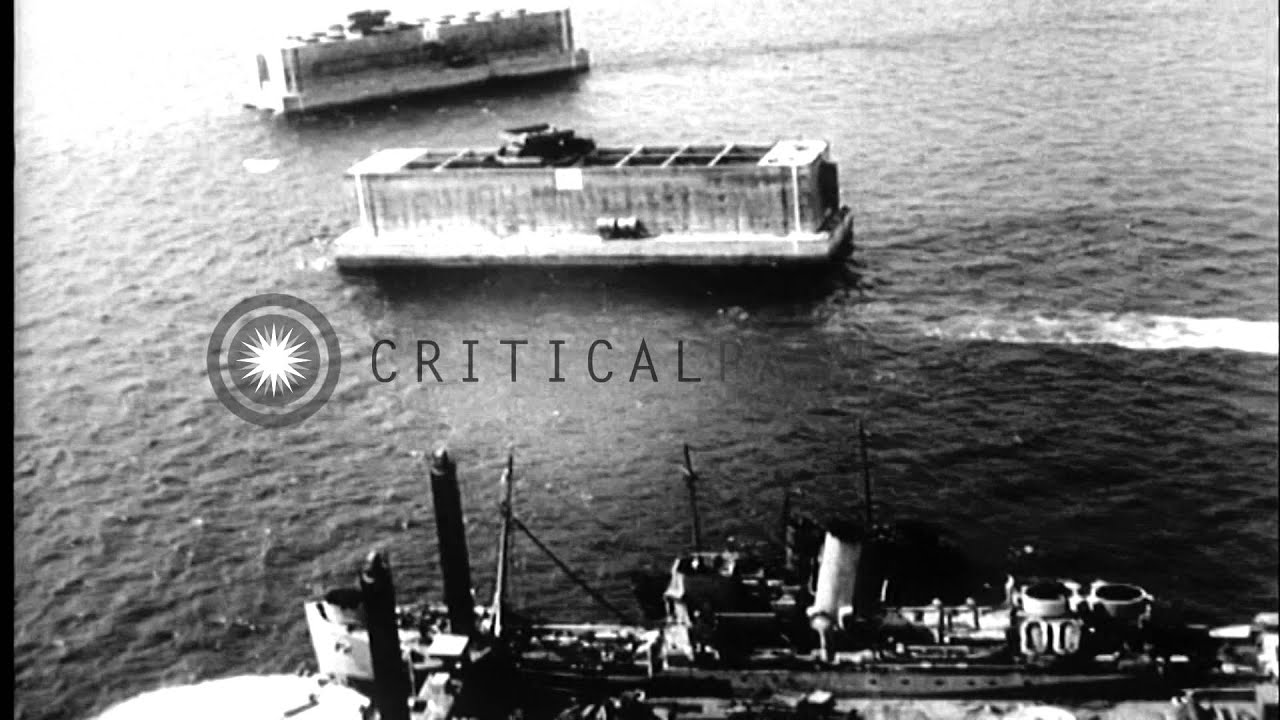 Construction of phoenix units, a Lobnitz pier head, and a pontoon bridge by the S...HD Stock Footage