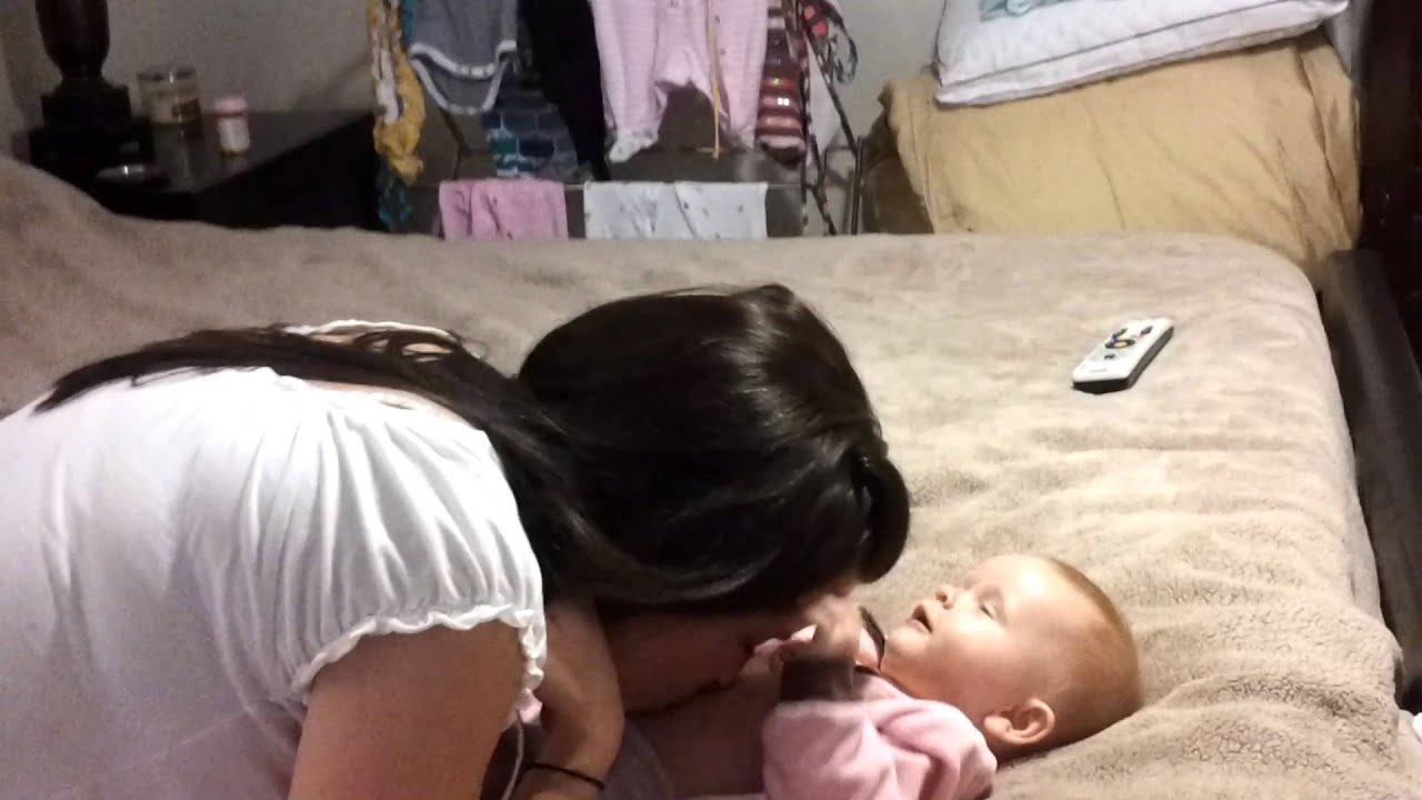Blowing on the belly of The Cutest Baby Girl