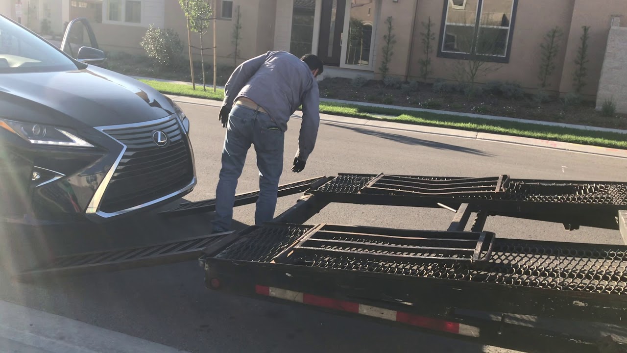 Loading SUV Onto Open Carrier Truck - ABC Auto Shipping