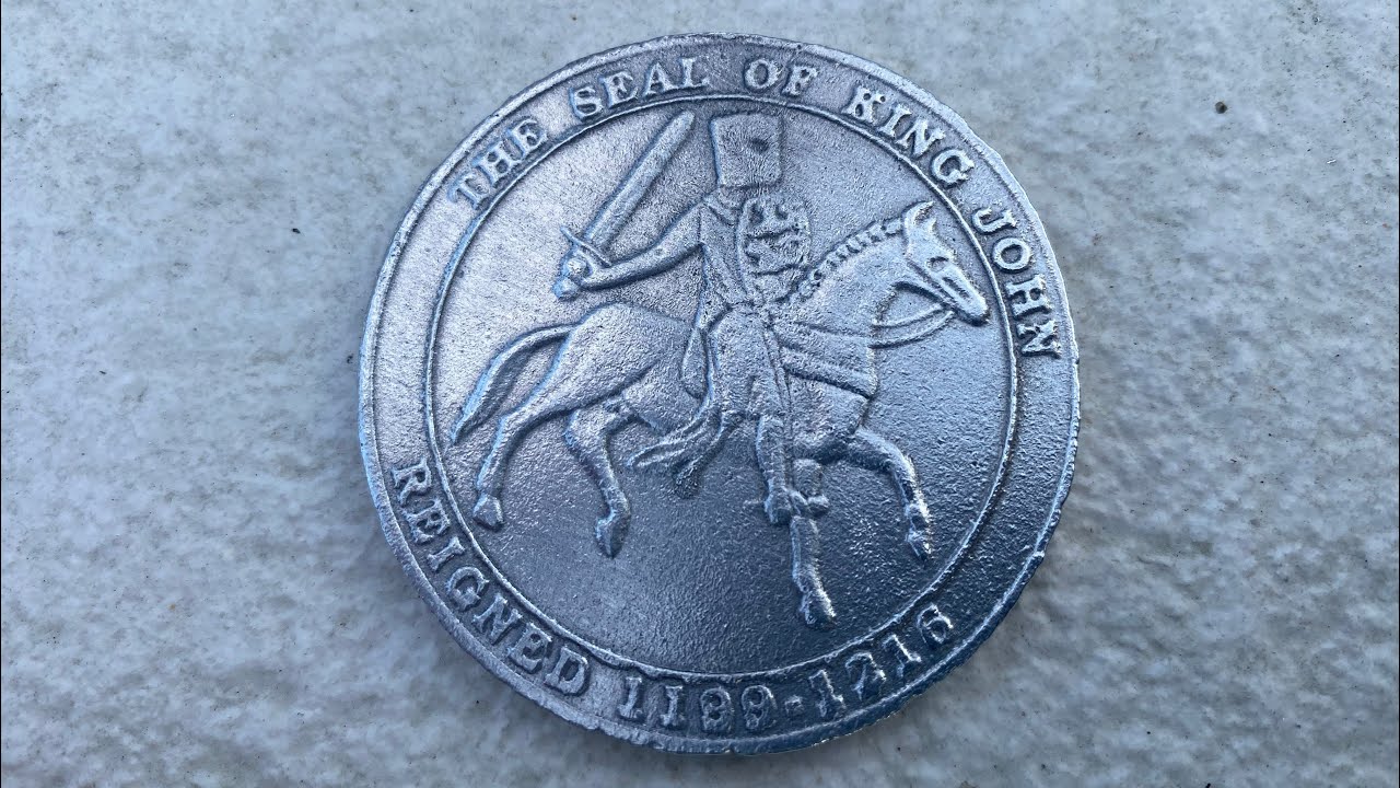 Sand casting a coin from aluminium cans ( petrobond ) the seal of king john