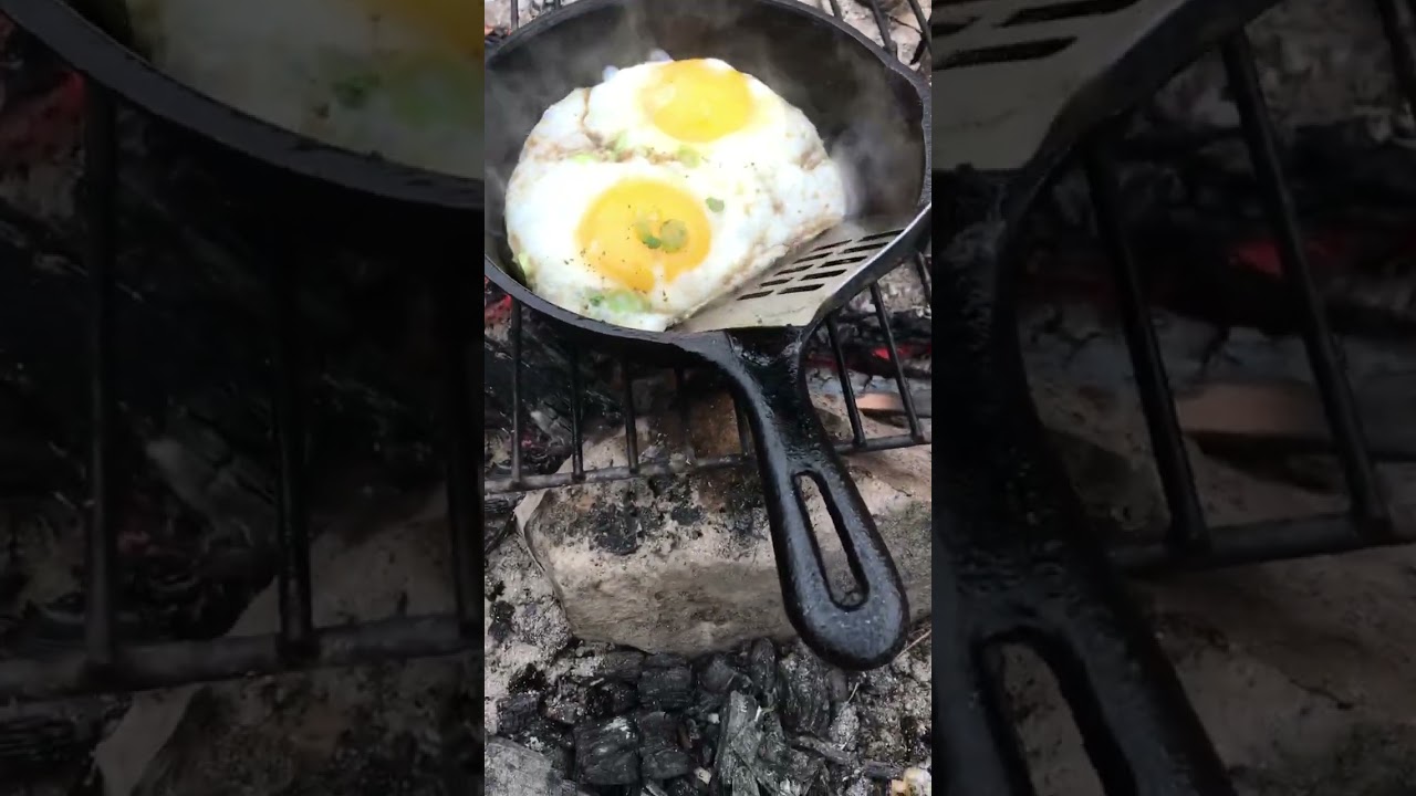 Campfire Eggs over easy in a cast iron pan