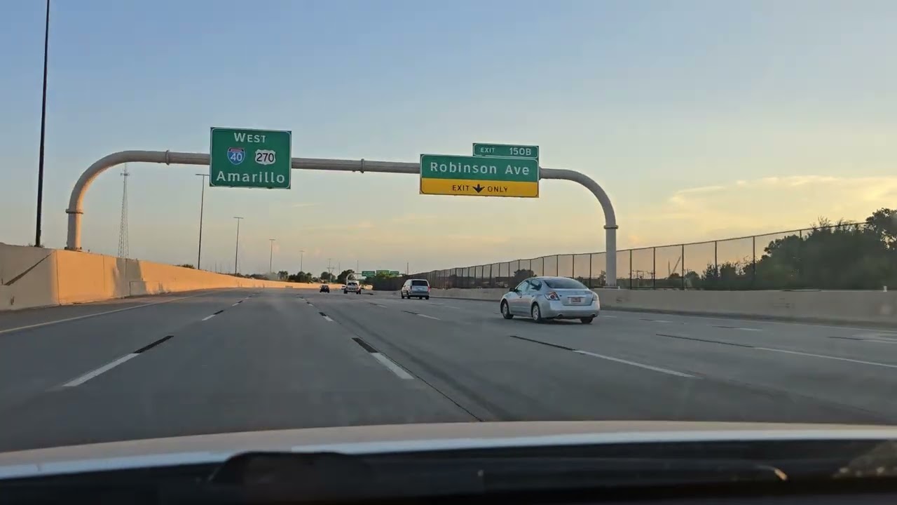 Driving I-40 westbound in Oklahoma City during sunset