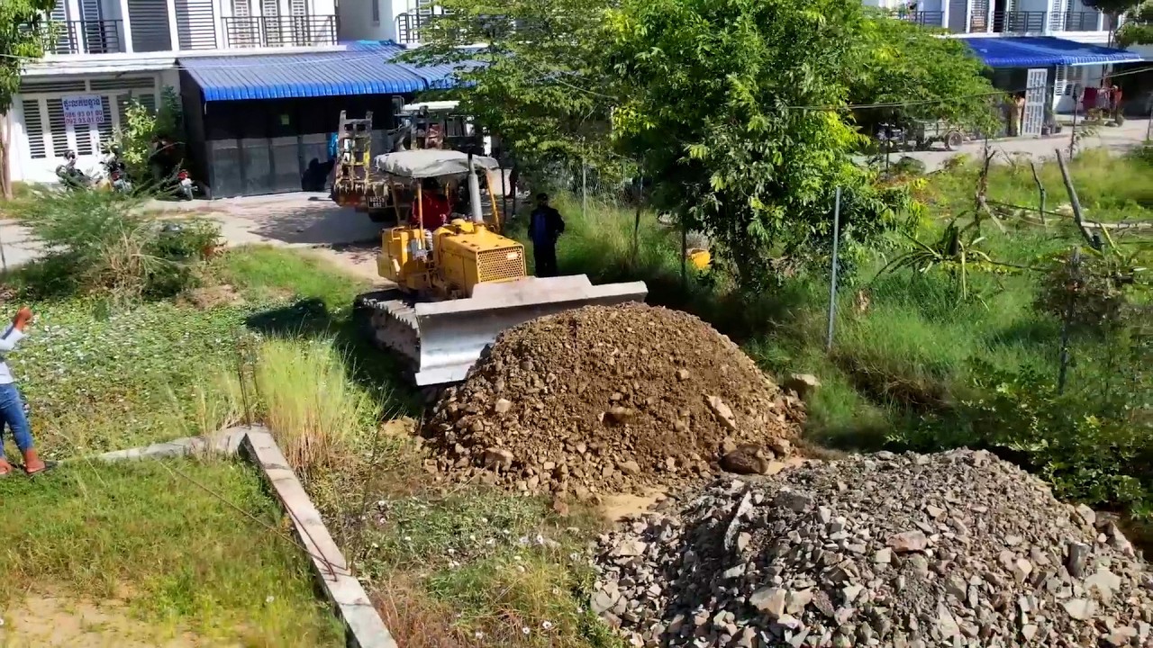 Full videoMaking Foundation New Road Crossing Water By Skill Operator Komatsu D31 Dozer Moving Stone