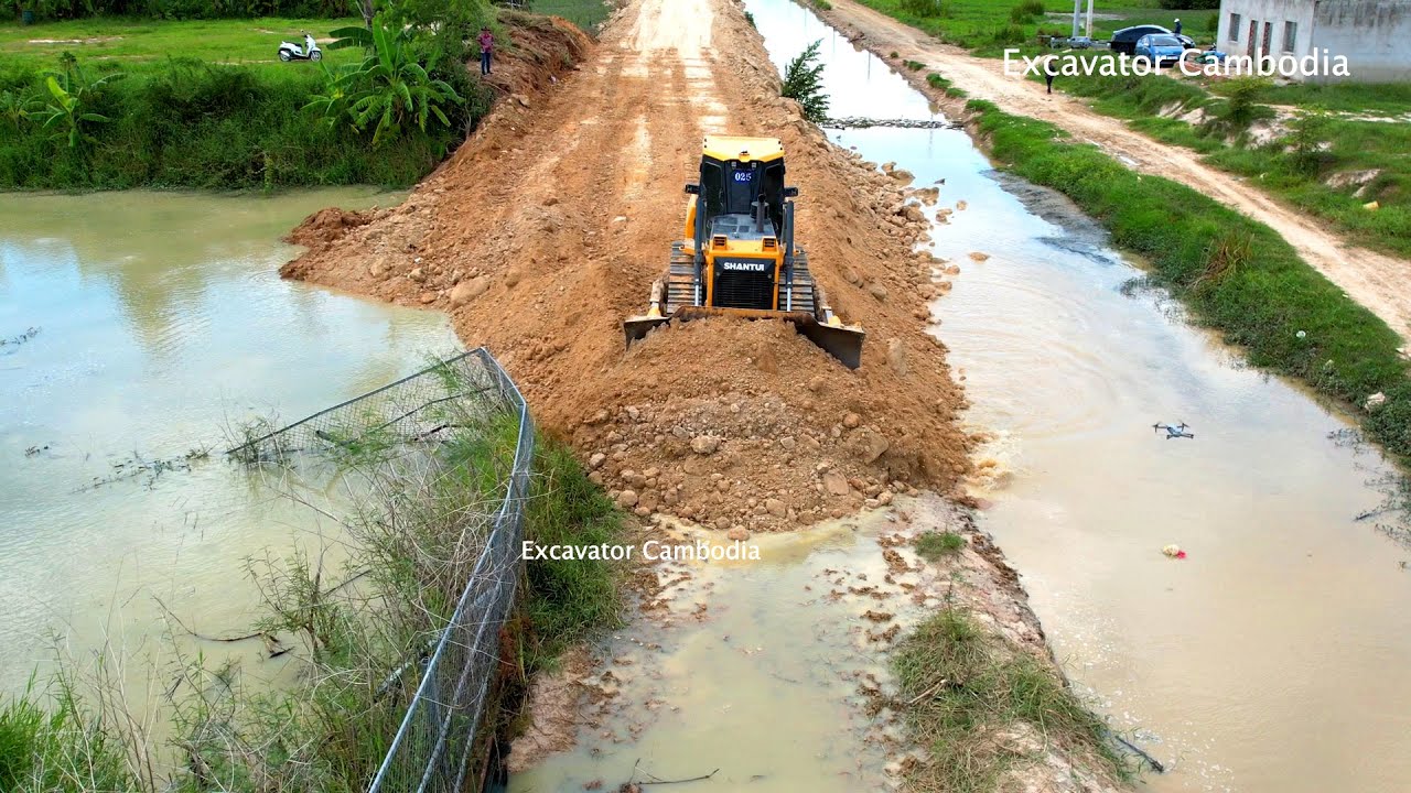 Amazing connecting road by shantui dh17c3 bulldozer made in china and dump truck made in korea
