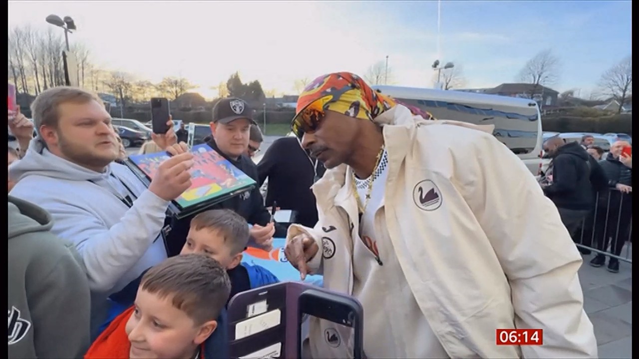 Co-owner Snoop Dogg receives grand welcome on first visit to Swansea City soccer club (Wales)